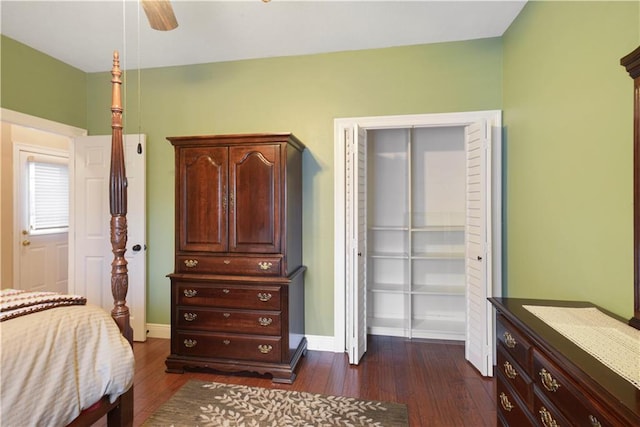 bedroom featuring a ceiling fan, dark wood finished floors, and baseboards