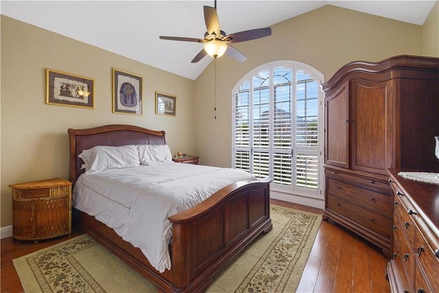 bedroom featuring vaulted ceiling, wood finished floors, and a ceiling fan