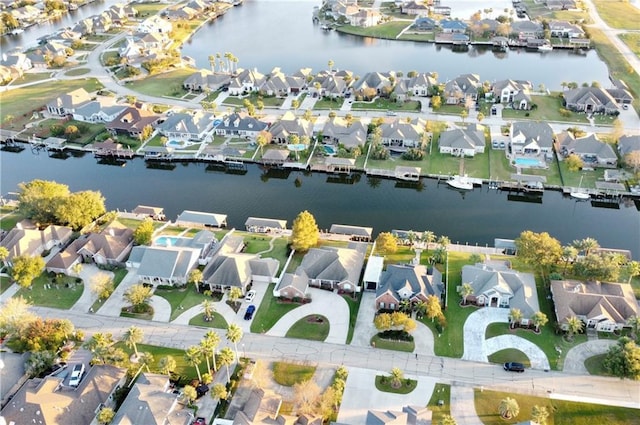 bird's eye view featuring a water view and a residential view