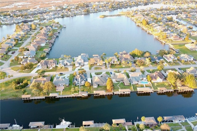 bird's eye view with a residential view and a water view