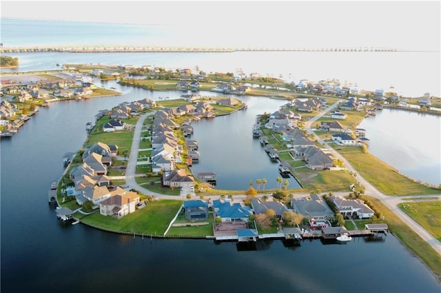 bird's eye view with a residential view and a water view