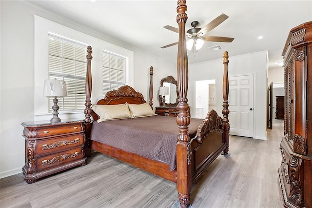 bedroom featuring ornamental molding, visible vents, ceiling fan, and wood finished floors