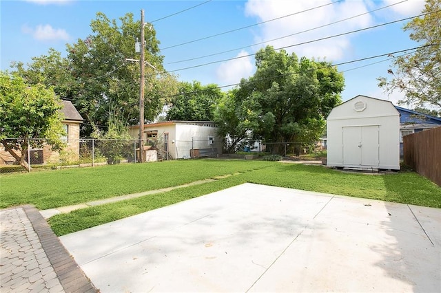 view of patio / terrace featuring a shed, a fenced backyard, and an outdoor structure