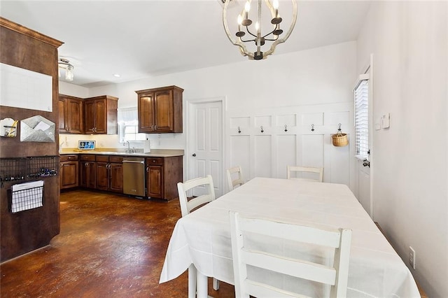 dining area featuring an inviting chandelier