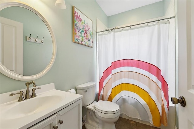 full bathroom featuring curtained shower, tile patterned flooring, vanity, and toilet