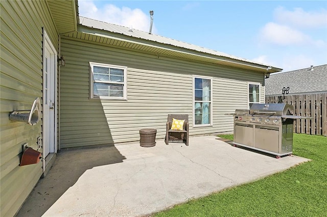 view of patio featuring fence and grilling area