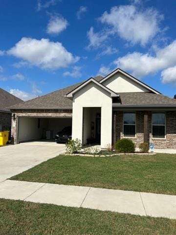 ranch-style house with concrete driveway, brick siding, an attached garage, and a front yard