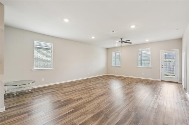 5635 Oak Trace Dr, Saint Gabriel, LA 70776 - spare room with plenty of natural light, wood finished floors, a ceiling fan, baseboards, and recessed lighting