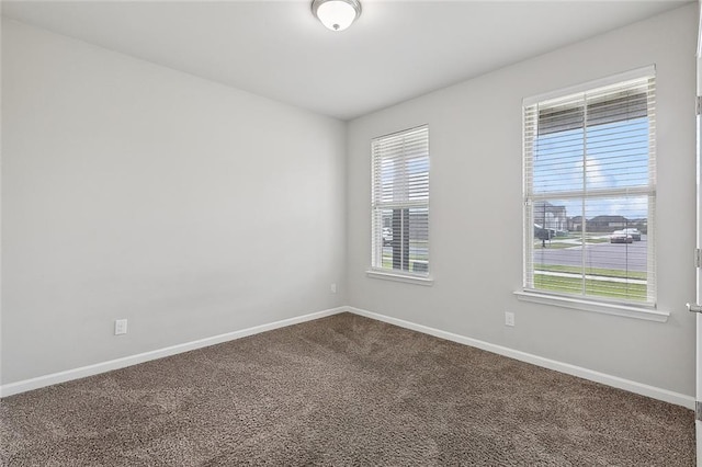 5635 Oak Trace Dr, Saint Gabriel, LA 70776 - empty room featuring baseboards and dark carpet