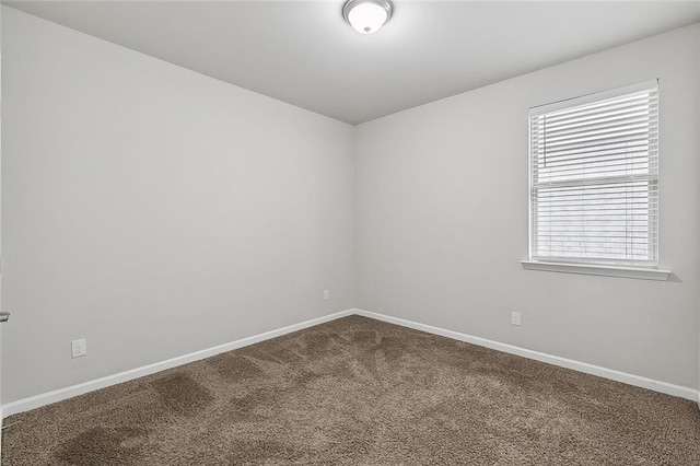 5635 Oak Trace Dr, Saint Gabriel, LA 70776 - empty room with dark colored carpet and baseboards