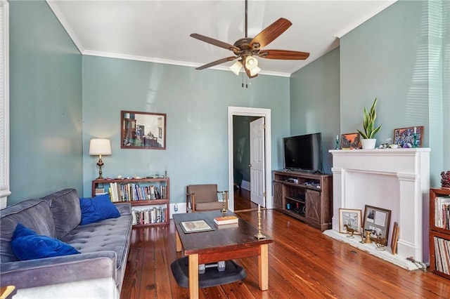 living room with ornamental molding, ceiling fan, and hardwood / wood-style flooring