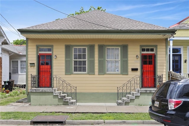 bungalow with a shingled roof