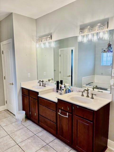 209 Legrande Bayou Ln, Kenner, LA 70065 - full bathroom featuring double vanity, tile patterned flooring, a sink, and a bath