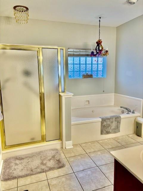 209 Legrande Bayou Ln, Kenner, LA 70065 - full bath featuring a garden tub, a stall shower, vanity, a chandelier, and tile patterned floors