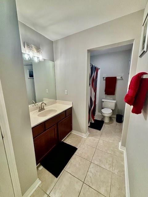 209 Legrande Bayou Ln, Kenner, LA 70065 - full bath featuring toilet, vanity, baseboards, and tile patterned floors