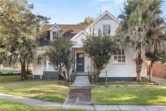 view of front of house with a front yard, crawl space, and roof with shingles