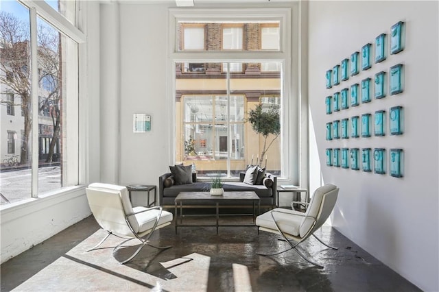 living area featuring concrete floors