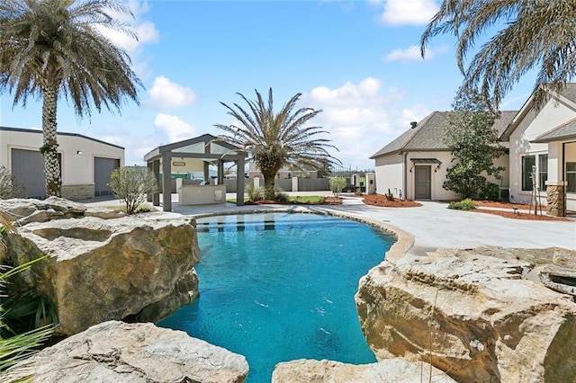 view of swimming pool with a gazebo, a patio area, fence, and a fenced in pool