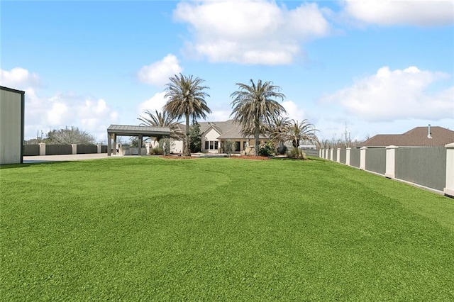 view of yard with fence and a pergola