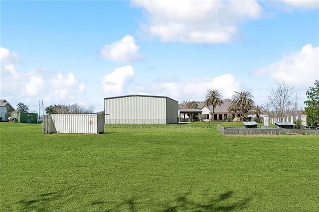 view of yard featuring a pole building and an outdoor structure