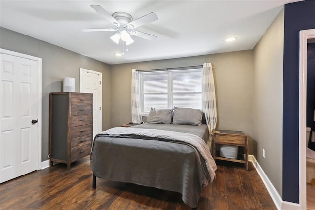 bedroom featuring a ceiling fan, baseboards, and wood finished floors