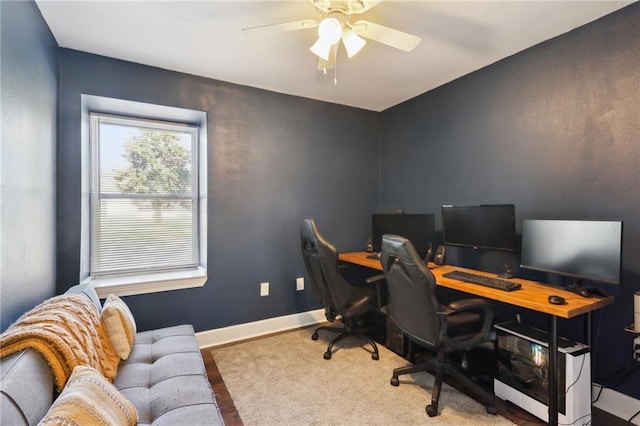 home office featuring baseboards and a ceiling fan