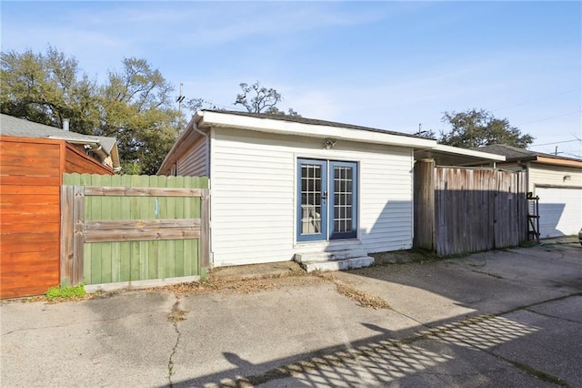 exterior space featuring entry steps and fence