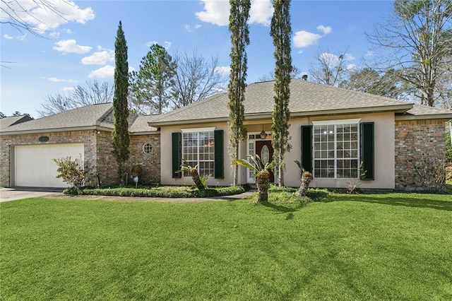 single story home featuring brick siding, a garage, driveway, and a front yard