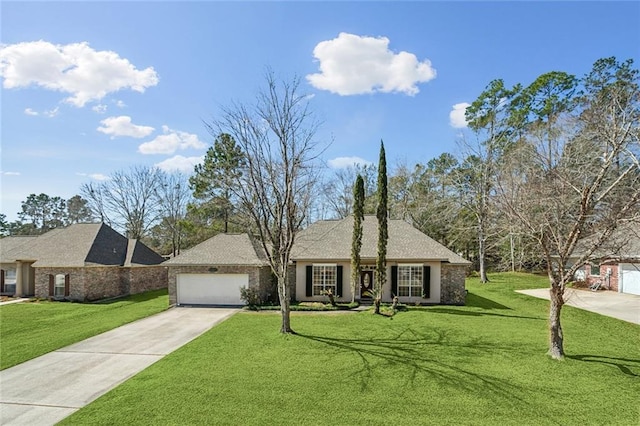 view of front of home with concrete driveway, an attached garage, and a front lawn