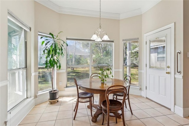 dining room featuring light tile patterned floors, a notable chandelier, crown molding, and baseboards