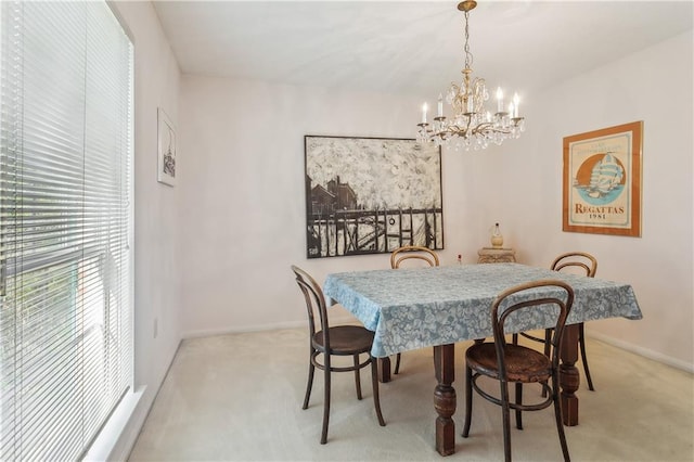 108 Bertel Dr, Covington, LA 70433 - dining room featuring baseboards, carpet flooring, and an inviting chandelier