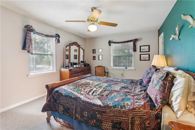 108 Bertel Dr, Covington, LA 70433 - bedroom with baseboards, carpet floors, a textured ceiling, and a ceiling fan