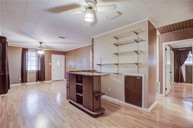 kitchen with visible vents, open shelves, and ornamental molding