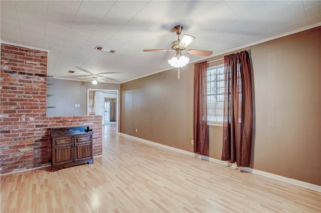 unfurnished living room with visible vents, baseboards, a ceiling fan, ornamental molding, and light wood-type flooring