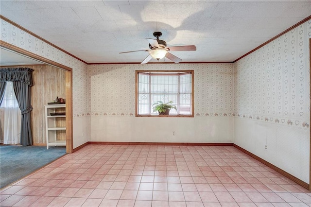 unfurnished room featuring ornamental molding, plenty of natural light, and wallpapered walls