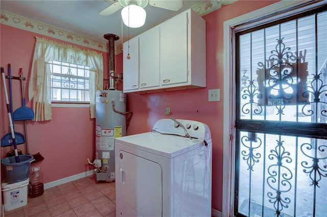 laundry room featuring washer / dryer, cabinet space, baseboards, ceiling fan, and water heater