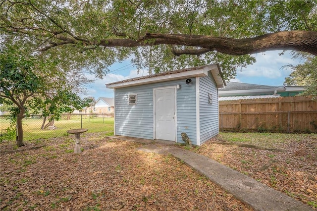 view of shed with fence