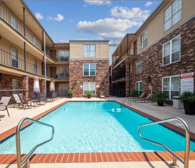 pool with a patio area