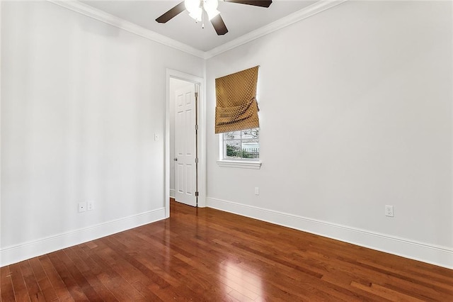 spare room with baseboards, a ceiling fan, hardwood / wood-style flooring, and crown molding