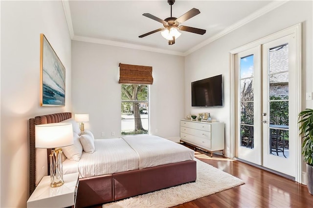 bedroom featuring ceiling fan, wood finished floors, access to exterior, crown molding, and french doors