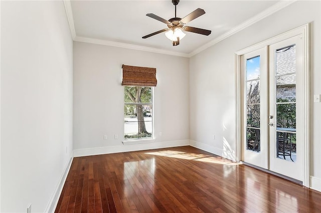 unfurnished room with baseboards, french doors, hardwood / wood-style floors, and crown molding