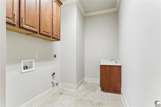 clothes washing area with cabinet space, baseboards, gas dryer hookup, hookup for an electric dryer, and washer hookup