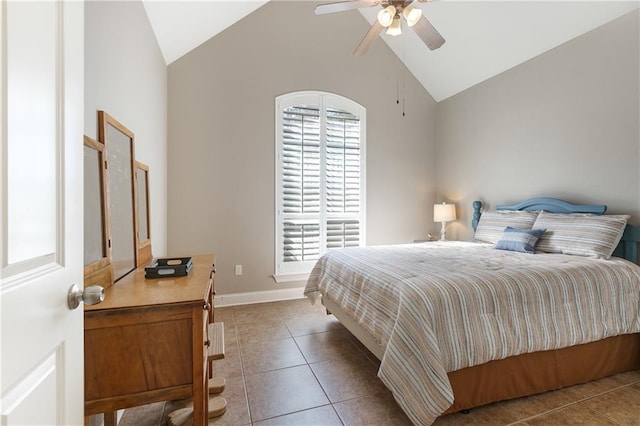 tiled bedroom featuring high vaulted ceiling, multiple windows, baseboards, and a ceiling fan