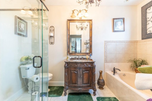 bathroom featuring a bath, vanity, toilet, and tile patterned floors