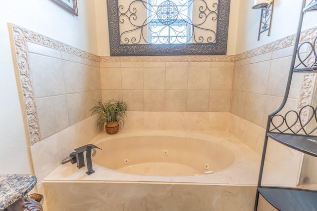 full bath with a whirlpool tub