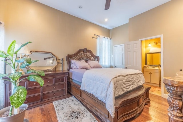 bedroom featuring recessed lighting, ceiling fan, wood finished floors, and ensuite bathroom