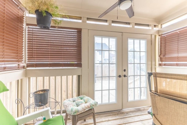 entryway with a healthy amount of sunlight, ornamental molding, and french doors