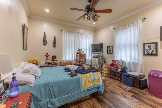 bedroom with ornamental molding, wood finished floors, a ceiling fan, and recessed lighting