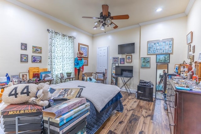 bedroom featuring recessed lighting, crown molding, and wood finished floors