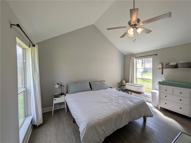 bedroom with lofted ceiling, wood finished floors, a ceiling fan, and baseboards